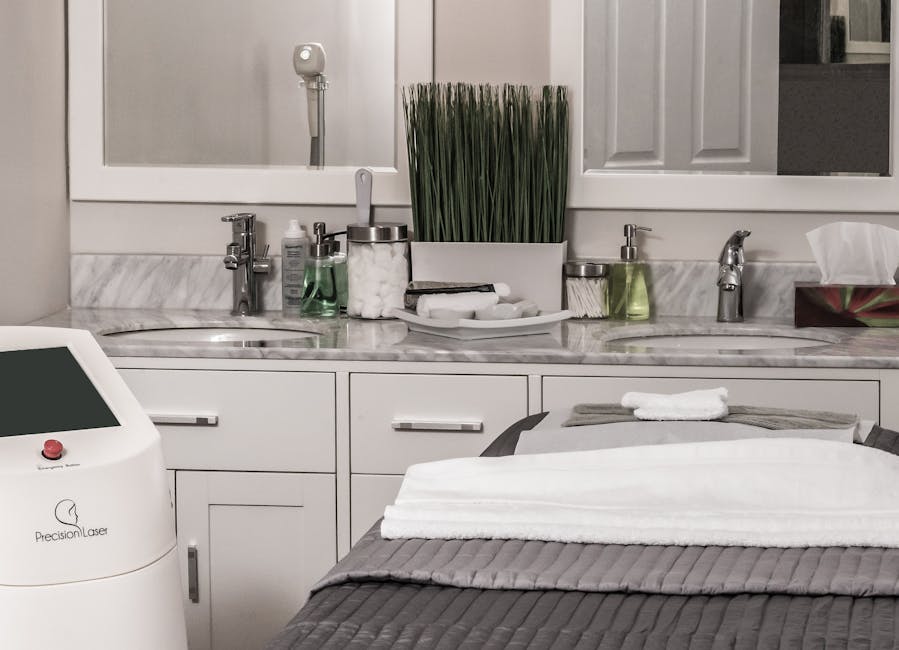 A serene and modern spa treatment room complete with precision laser equipment and elegant decor